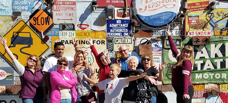 Group in front of route 66 signs